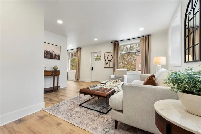 a view of a dining room with furniture window and wooden floor