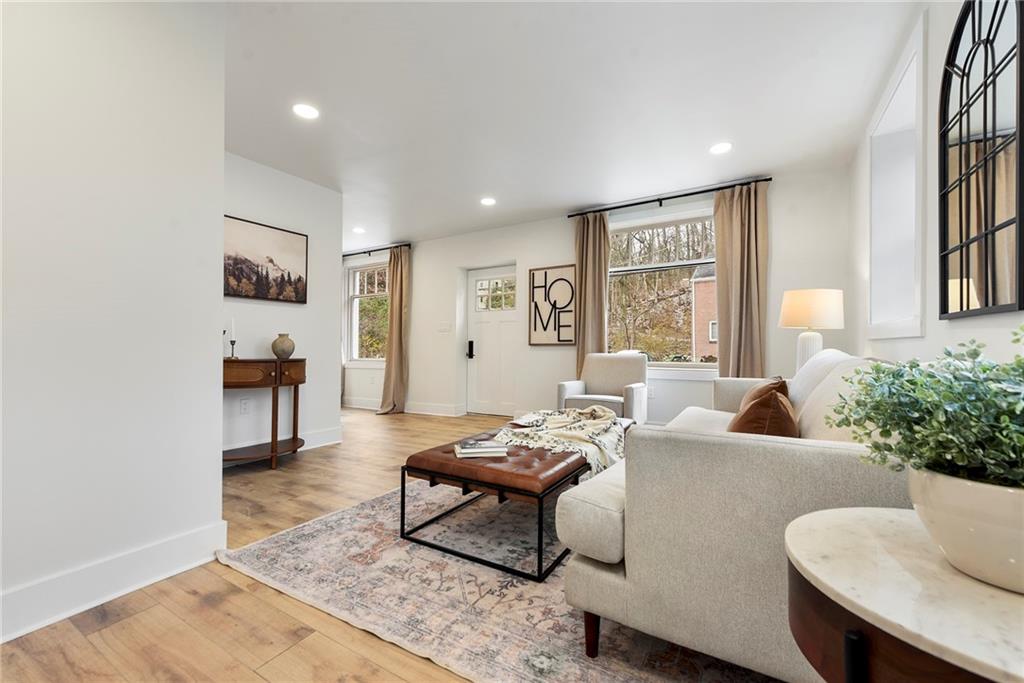 4978 South Pioneer Road Gibsonia, PA 15044 - Photo 16 of 49 a living room with furniture and a potted plant