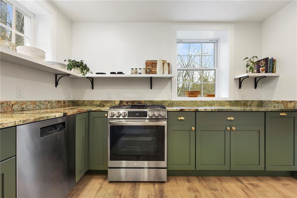 4978 South Pioneer Road Gibsonia, PA 15044 - Photo 17 of 49 a kitchen with granite countertop a sink stainless steel appliances and cabinets