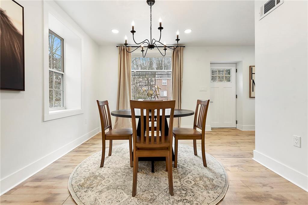 4978 South Pioneer Road Gibsonia, PA 15044 - Photo 27 of 49 a view of a dining room with furniture window and wooden floor