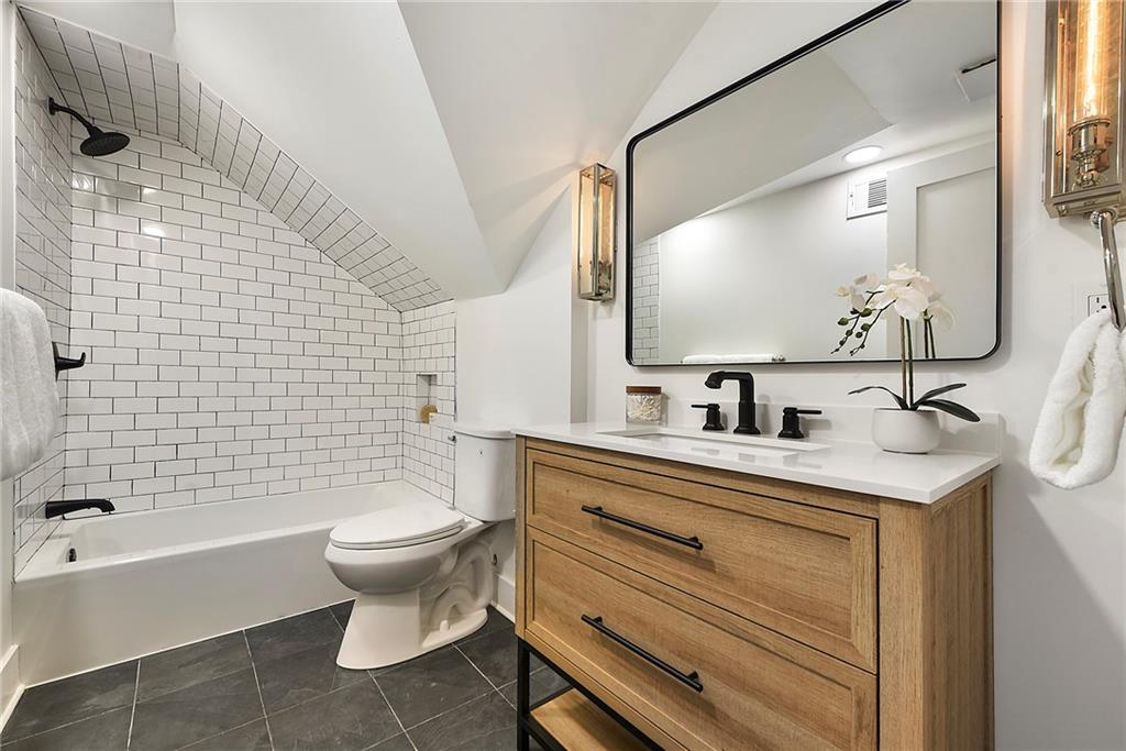 4978 South Pioneer Road Gibsonia, PA 15044 - Photo 31 of 49 a bathroom with a sink toilet mirror and shower