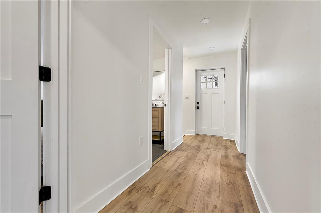 4978 South Pioneer Road Gibsonia, PA 15044 - Photo 39 of 49 a view of a hallway with wooden floor and staircase