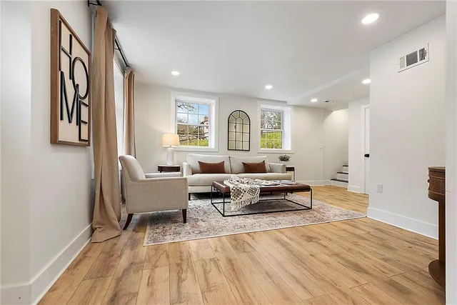 a living room with furniture and a large window