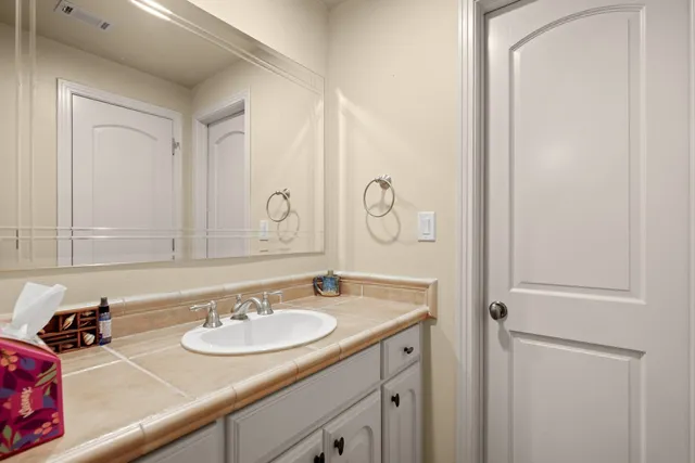 a view of a patio with a table chairs and a backyard