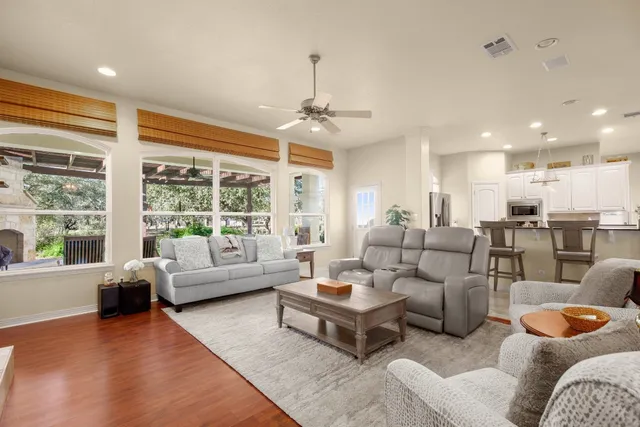 a living room with furniture and a large window