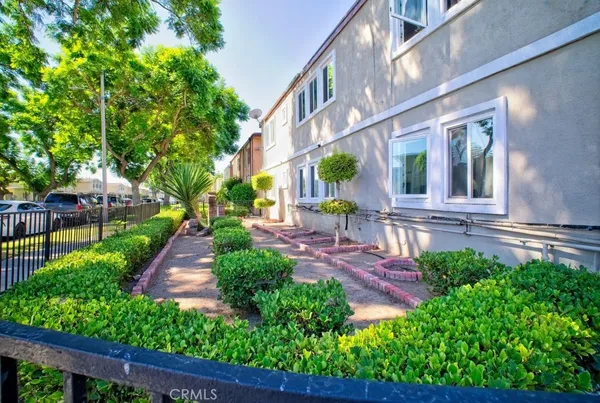 a view of a pathway with a patio