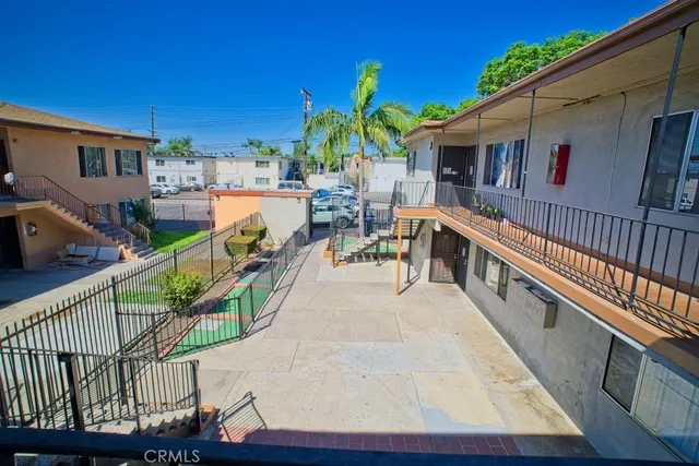a view of balcony with deck and wooden fence