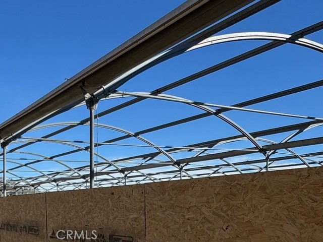 54740 Cave Rock Road Anza, CA 92539 - Photo 15 of 47 a blue umbrella sitting on the side of a building