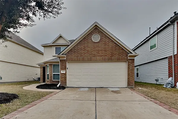 a view of garage and yard