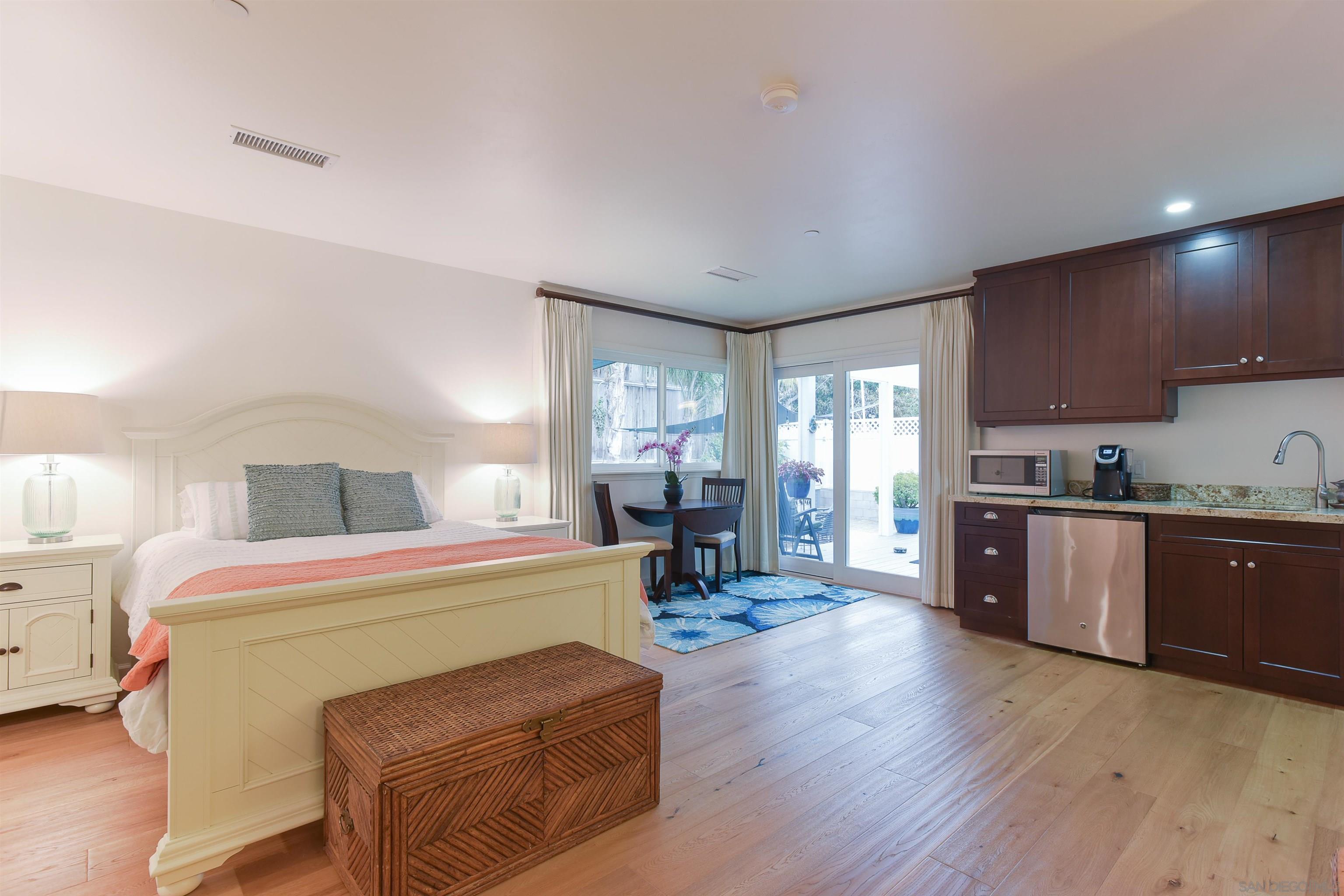 222 Barbara Avenue Solana Beach, CA 92075 - Photo 16 of 37 a living room with furniture and a wooden floor