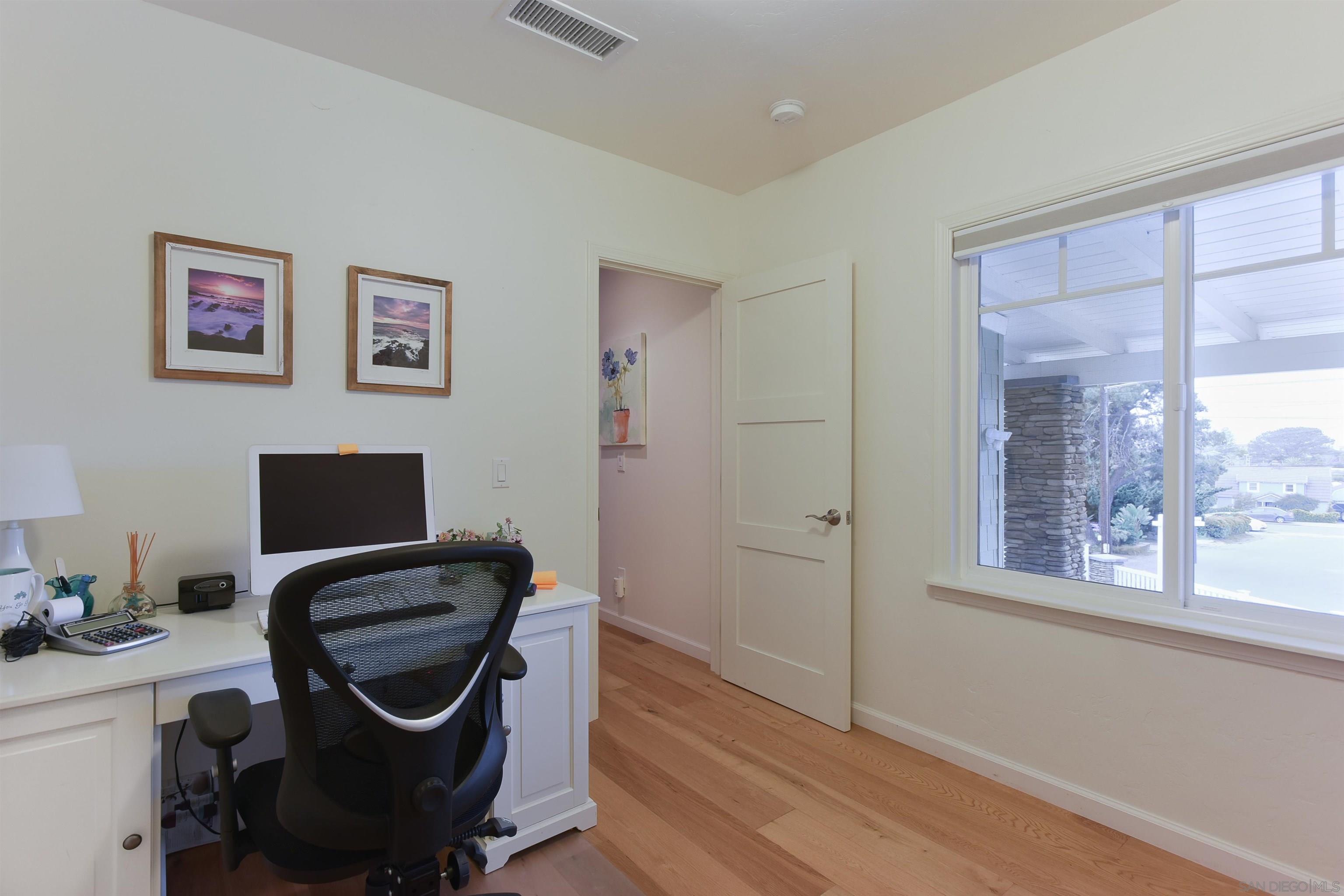 222 Barbara Avenue Solana Beach, CA 92075 - Photo 22 of 37 a view of a workspace with furniture and a window