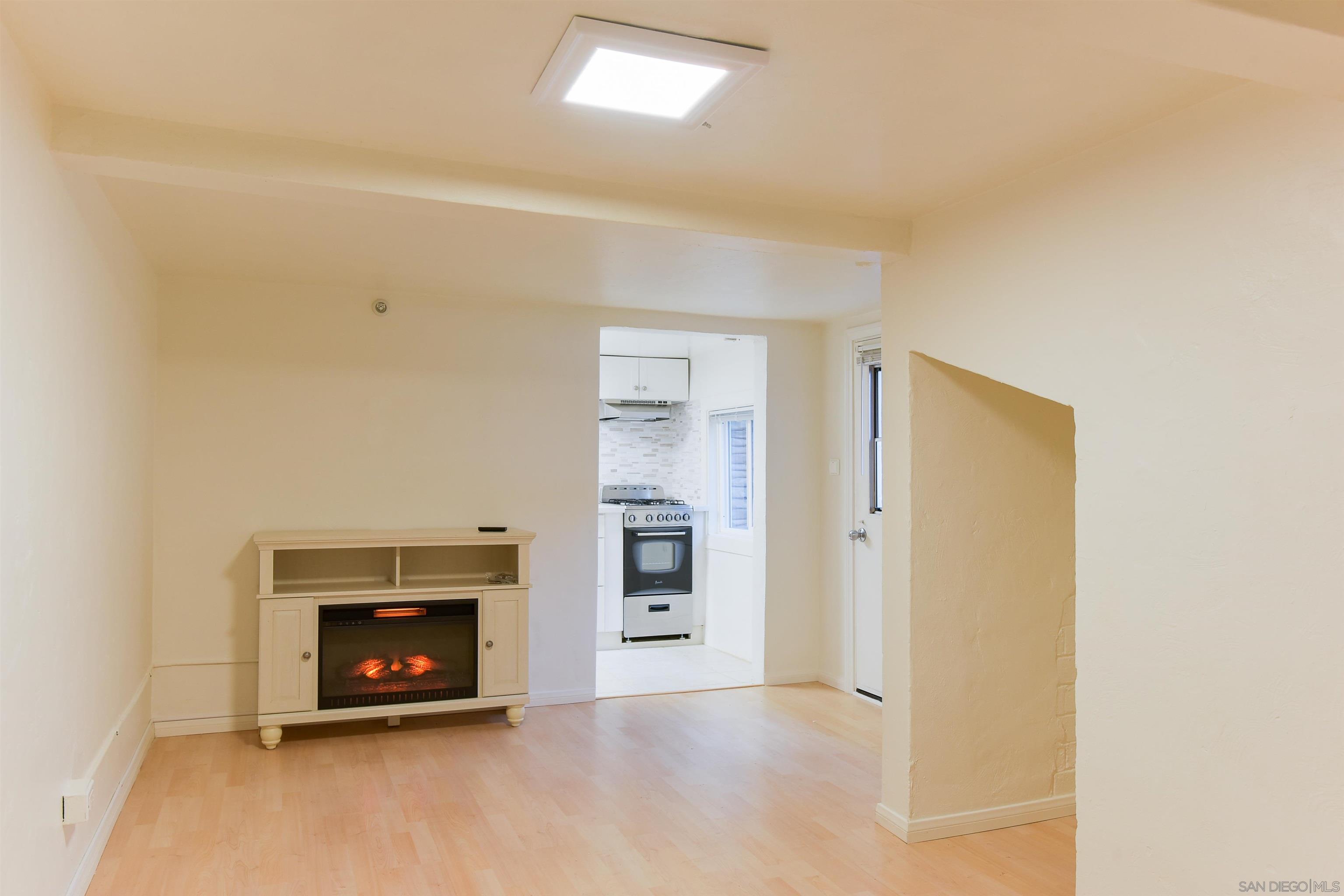 222 Barbara Avenue Solana Beach, CA 92075 - Photo 29 of 37 a view of an empty room with a fireplace and a window