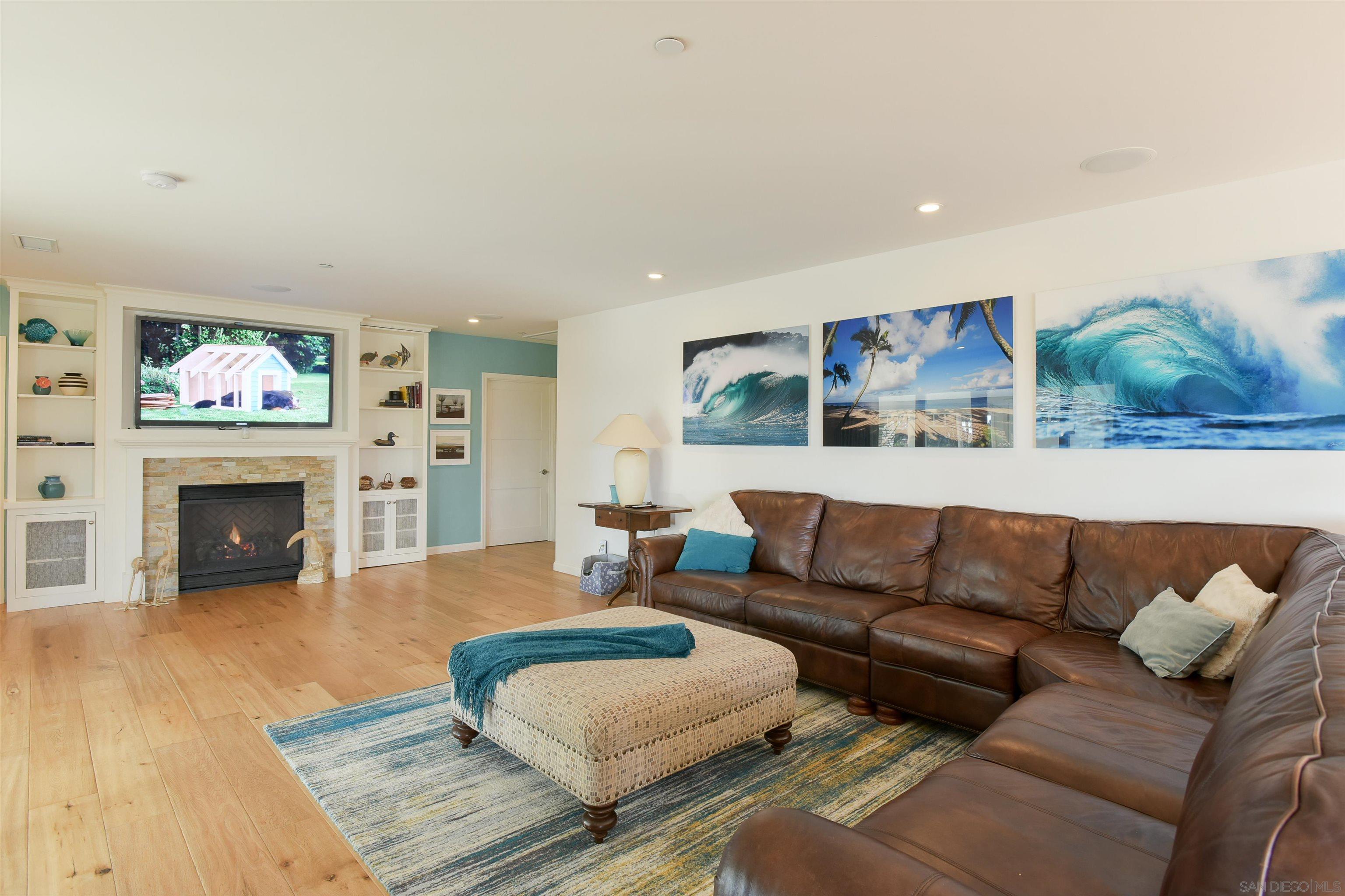 222 Barbara Avenue Solana Beach, CA 92075 - Photo 6 of 37 a living room with furniture and a fireplace