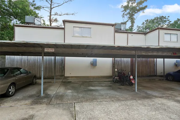 a view of a car park and a car parked in garage