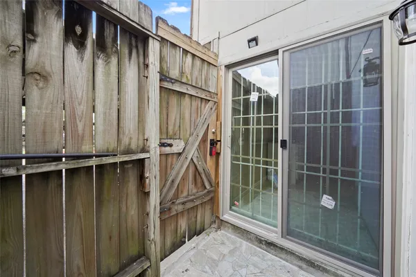 a view of an entryway with wooden floor