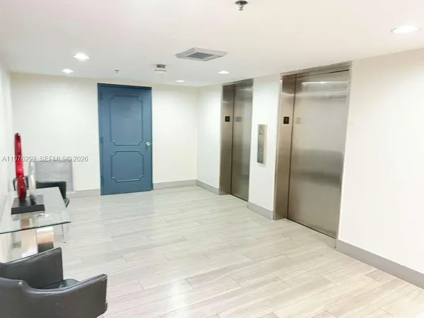 a view of hallway with wooden floor