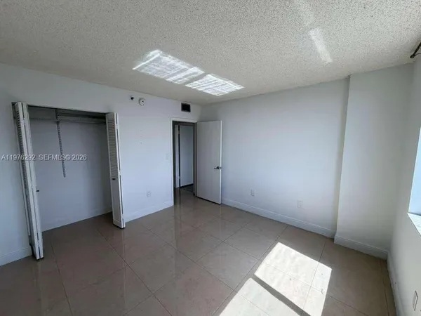 a view of entryway with bathroom