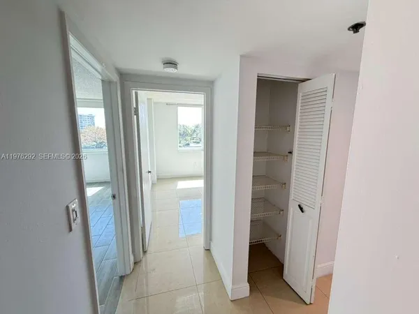a bathroom with a sink mirror vanity and toilet