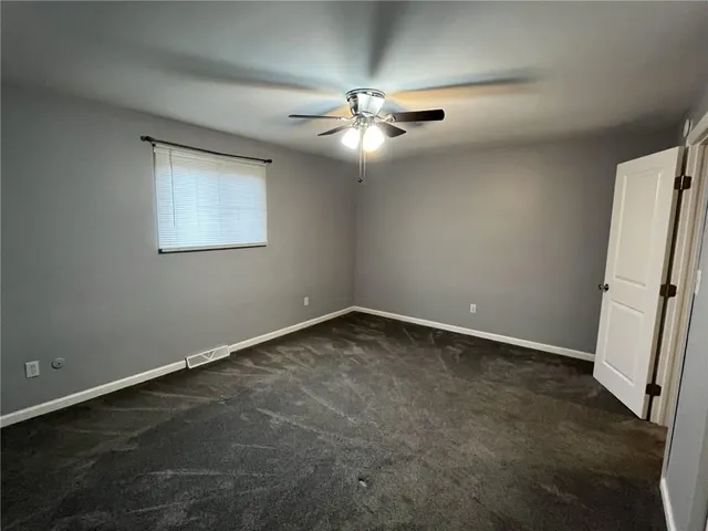 a view of a hallway with staircase
