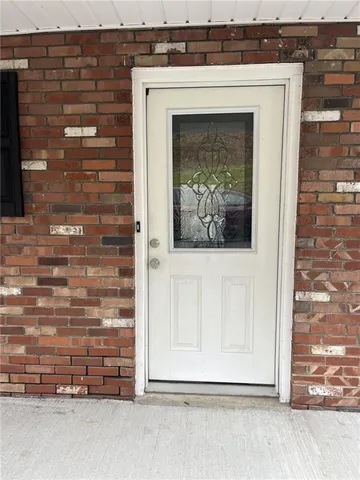 a view of a door with a fireplace