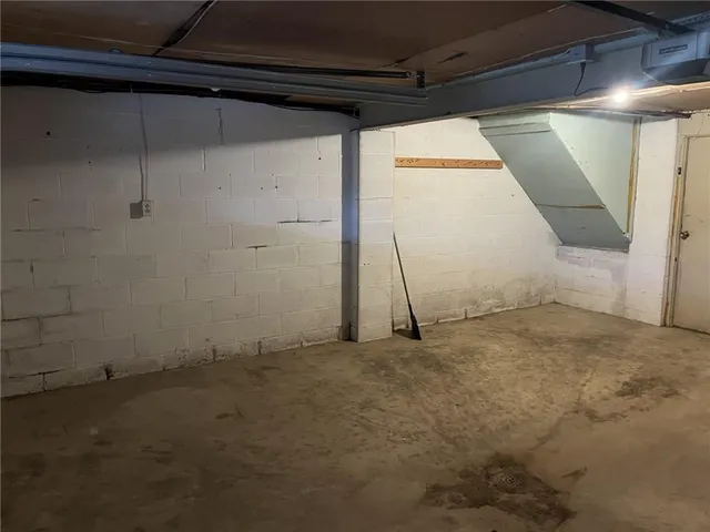 a view of room with rack and wooden floor