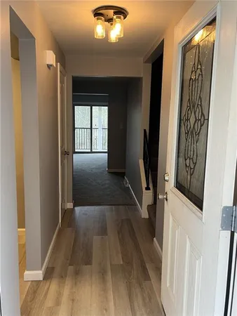 a view of entryway with wooden floor