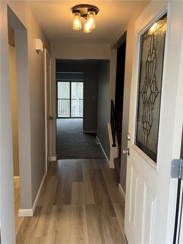 a view of entryway with wooden floor