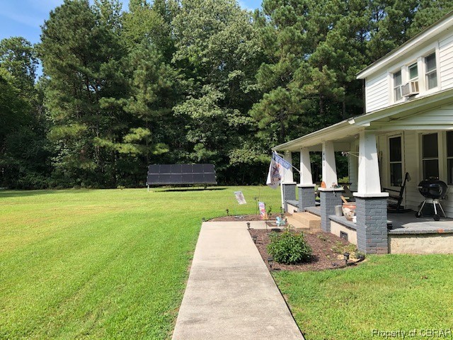 460 Holly Point Road Mathews, VA 23109 - Photo 2 of 16 a front view of house with yard and green space