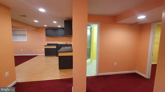 a kitchen with stainless steel appliances a refrigerator and a stove