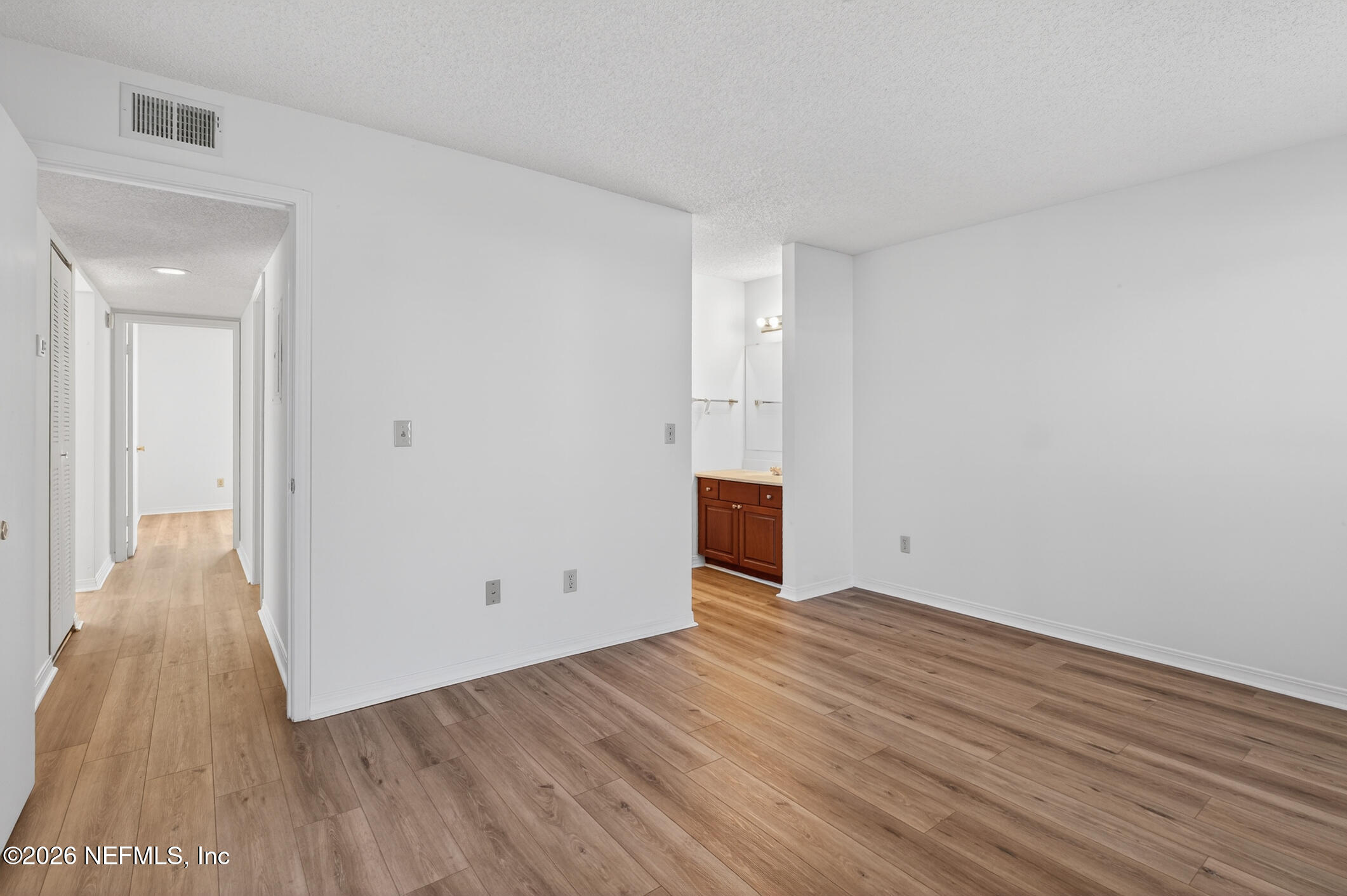 10200 Belle Rive Boulevard, Unit 105 Jacksonville, FL 32256 - Photo 28 of 47 a view of an empty room with wooden floor