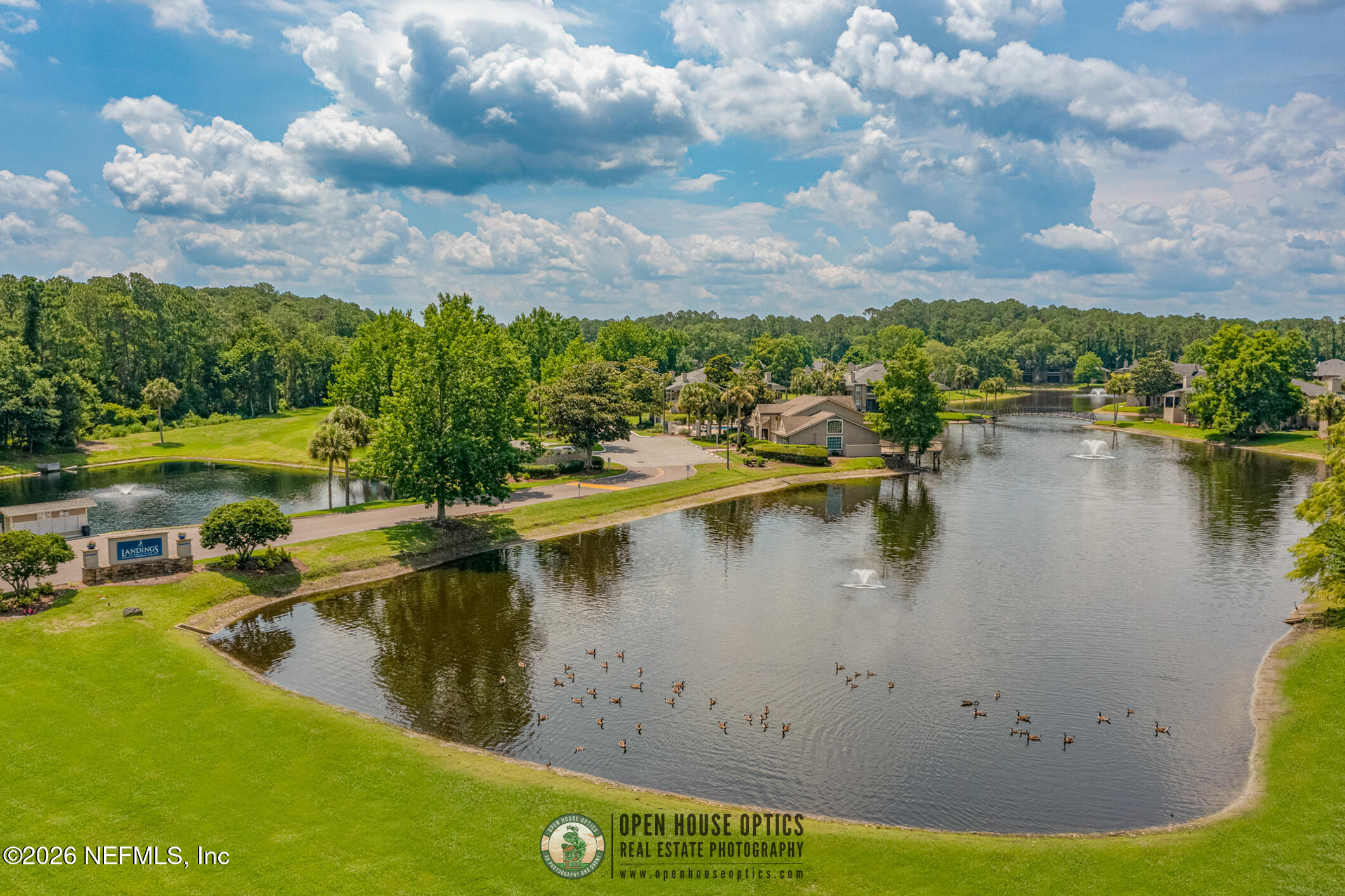 10200 Belle Rive Boulevard, Unit 105 Jacksonville, FL 32256 - Photo 46 of 47 a view of a lake from a yard