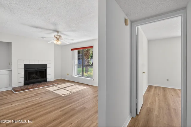 a kitchen with stainless steel appliances granite countertop a stove a microwave and a sink