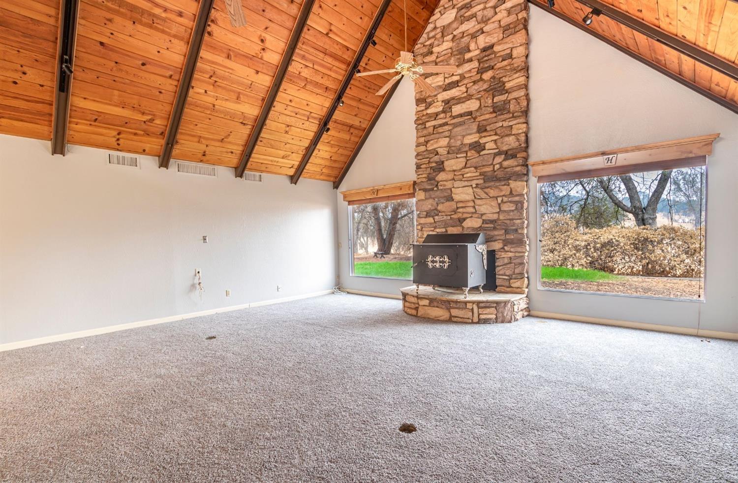 22235 Frontier Road Clovis, CA 93619 - Photo 11 of 31 Family room with large wood stove.