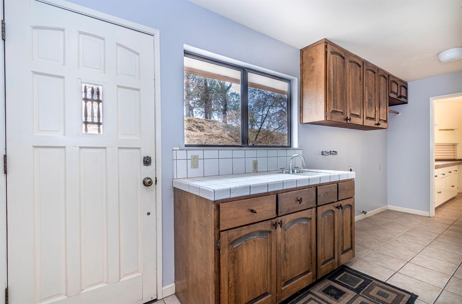 22235 Frontier Road Clovis, CA 93619 - Photo 27 of 31 Laundry room with entrance to front of the house.