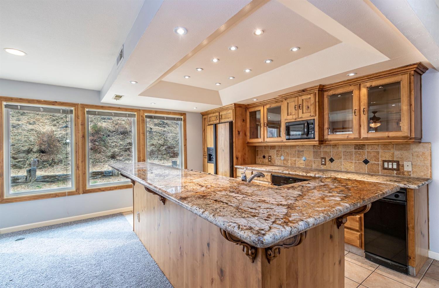 Kitchen with eating counter.