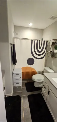 a view of a backyard with plants and a patio