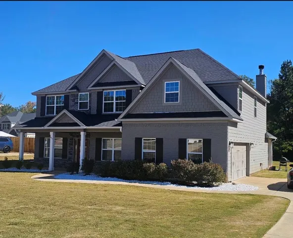 a front view of a house with a yard