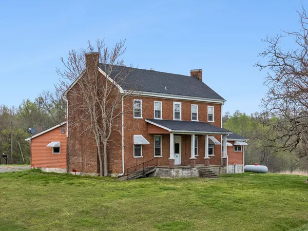 a aerial view of a house with a yard