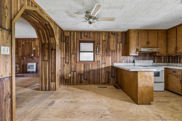 a kitchen with sink cabinets and window