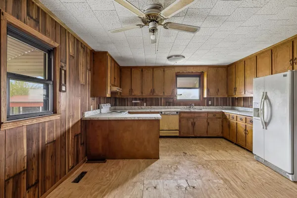 a view of an empty room with a fireplace