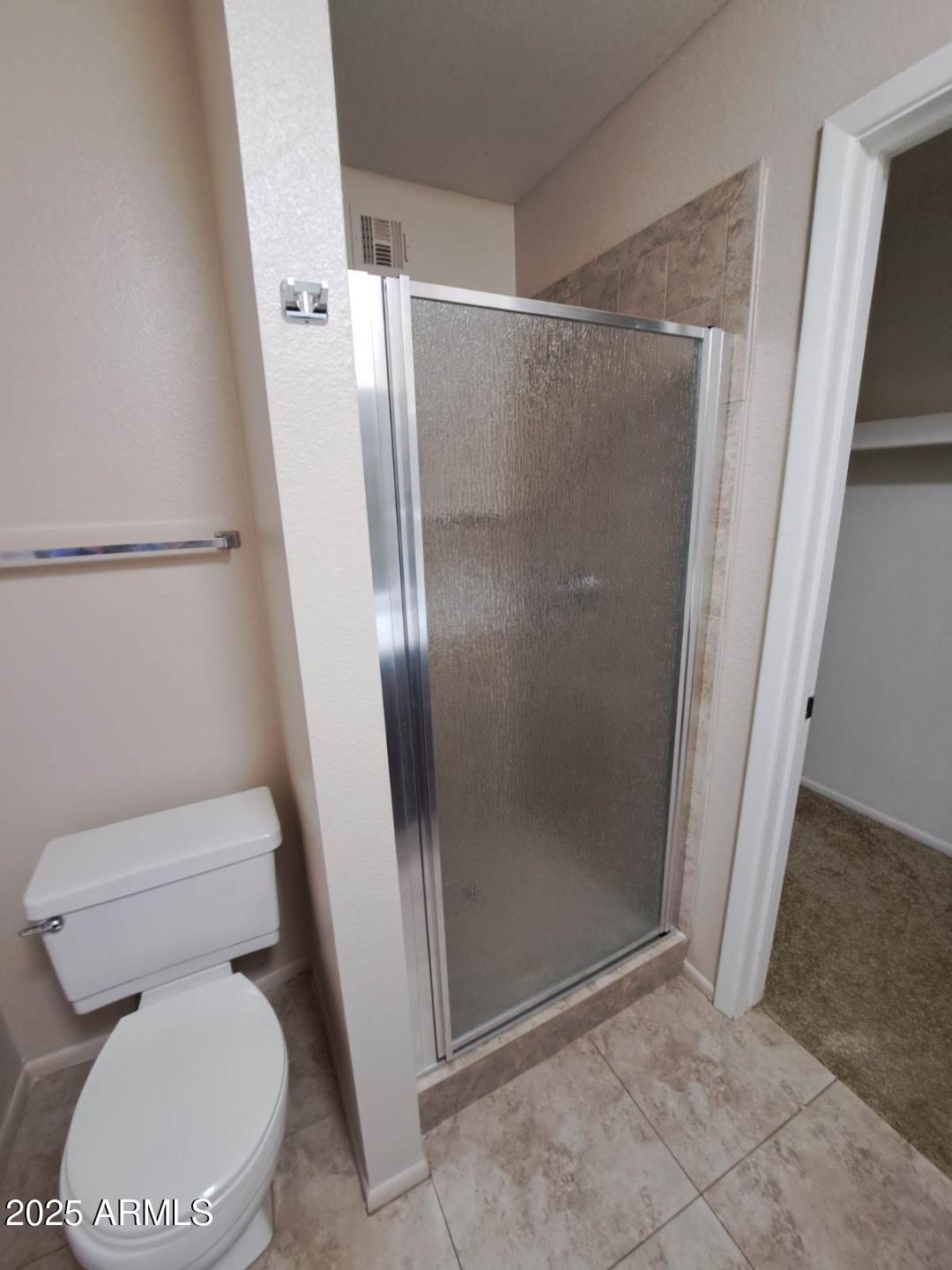 834 South Casitas Drive, Unit B Tempe, AZ 85288 - Photo 11 of 23 a white toilet sitting next to a shower