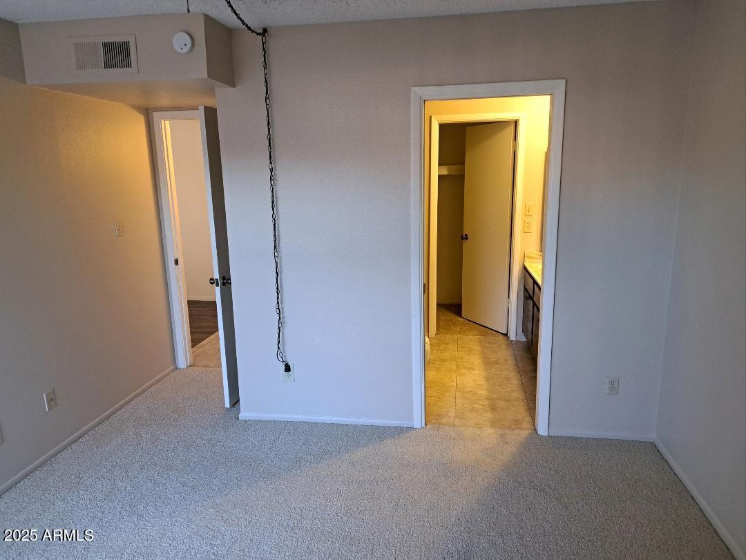 834 South Casitas Drive, Unit B Tempe, AZ 85288 - Photo 16 of 23 a view of a room with a hallway