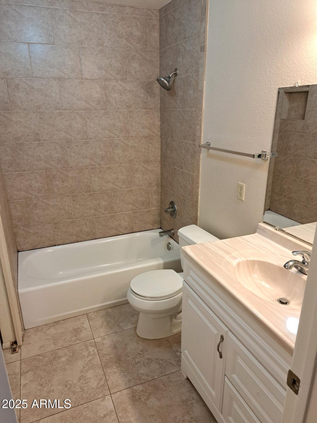 834 South Casitas Drive, Unit B Tempe, AZ 85288 - Photo 17 of 23 a bathroom with a granite countertop toilet a sink and bathtub