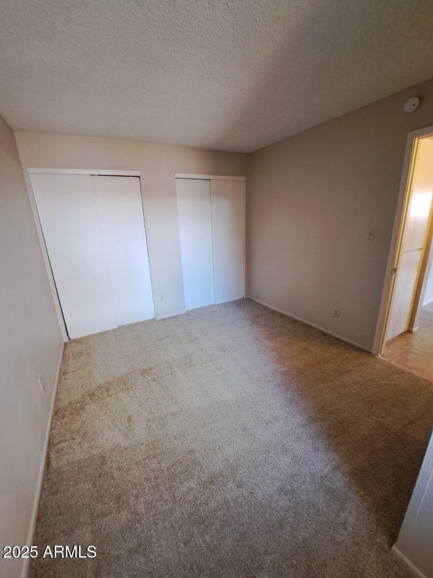 834 South Casitas Drive, Unit B Tempe, AZ 85288 - Photo 19 of 23 an empty room with a natural light