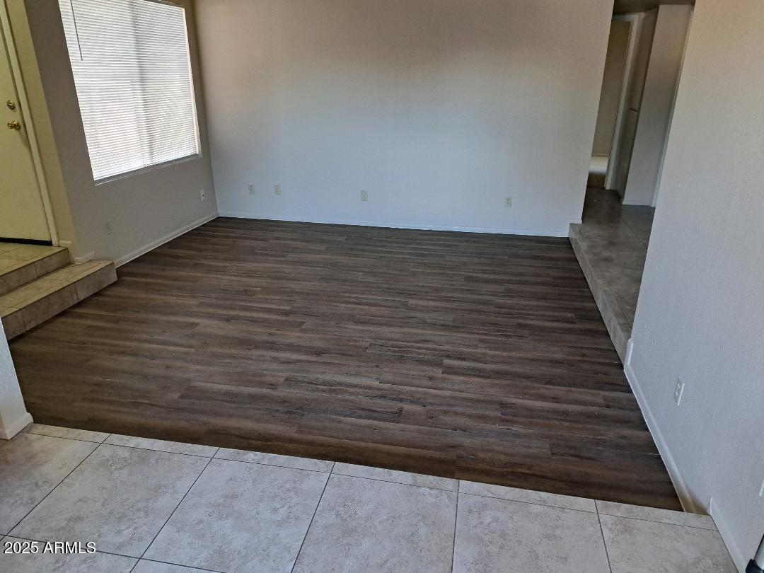 834 South Casitas Drive, Unit B Tempe, AZ 85288 - Photo 9 of 23 a view of a hallway with wooden floor and staircase