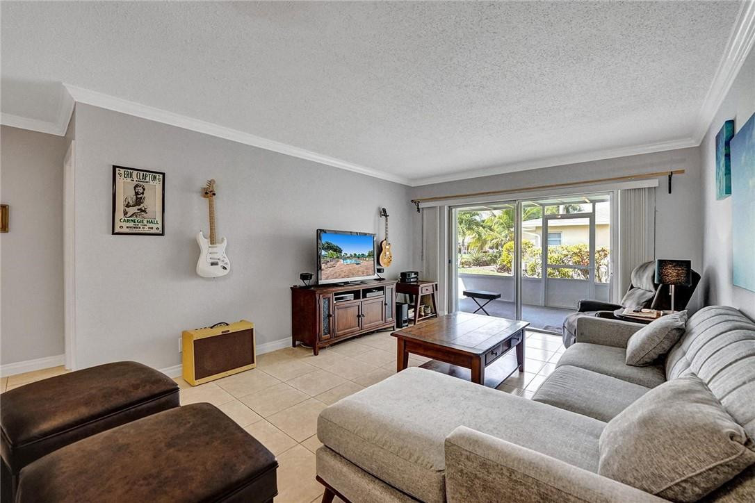 20830 Wendall Terrace, Unit 58 Boca Raton, FL 33433 - Photo 14 of 27 a living room with furniture and a window
