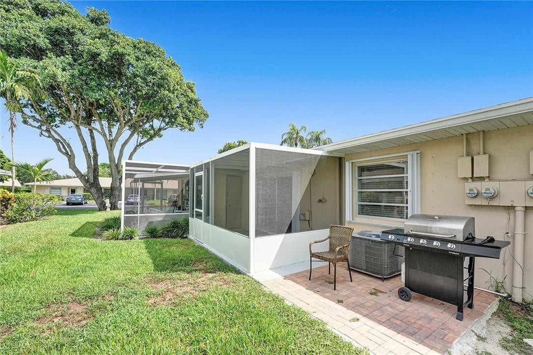 20830 Wendall Terrace, Unit 58 Boca Raton, FL 33433 - Photo 19 of 27 a view of a house with backyard porch and sitting area