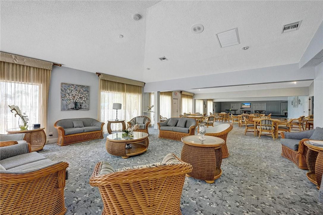 20830 Wendall Terrace, Unit 58 Boca Raton, FL 33433 - Photo 26 of 27 a living room with furniture and a large window