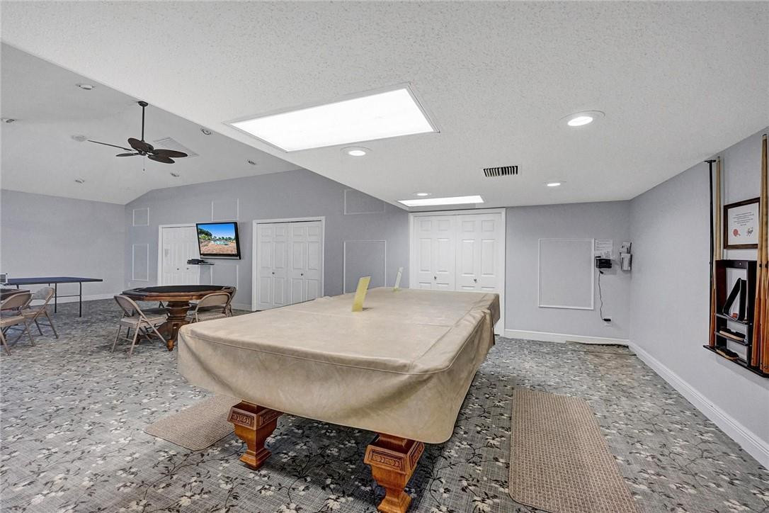 20830 Wendall Terrace, Unit 58 Boca Raton, FL 33433 - Photo 27 of 27 a living room with stainless steel appliances furniture a rug and a window