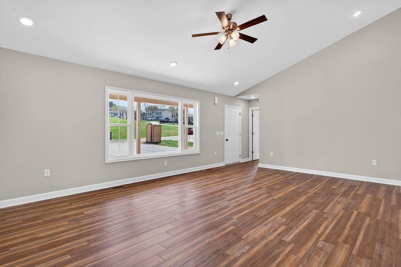 254 Locustdale Loop Shenandoah, VA 22849 - Photo 15 of 58 an empty room with wooden floor fan and windows